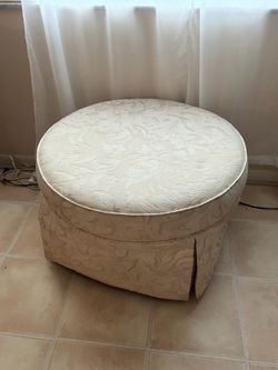 Round Upholstered Ottoman with Skirted Base