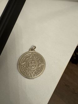 Silver Aztec calendar pendant