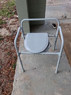 Small wheelchair in porta potty