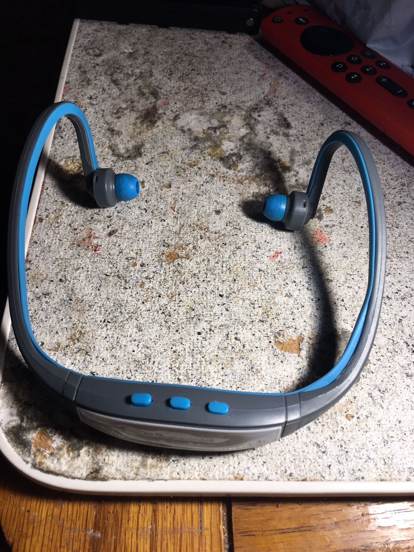 grey/blue bluetooth headset