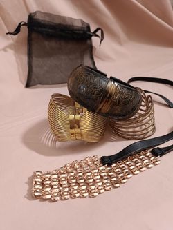 statement-jewelry set features a mix of vintage-inspired, boho, and glamour fashion accessories, packaged with a sheer black organza gift pouch