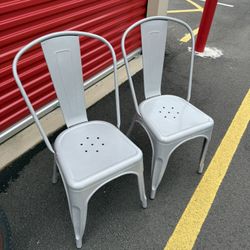 Pair Of Stacking Metal Dining Chairs