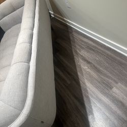 Cream tufted sofa for sale. 