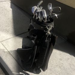 Golf bag and golf clubs  irons (contact info removed) p wedge and 56” wedge and a putter all for 135