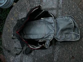 Black camelback Hiking Backpack with Red Zippers