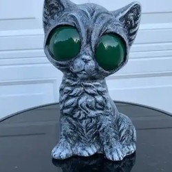 Big green eyed kitty cat statue