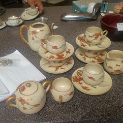 Tea set minus the pitcher it was broken.