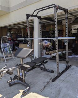 Entire Workout gym includes •squat rack •bench/curl/leg•45lb bar•300lb of free weights