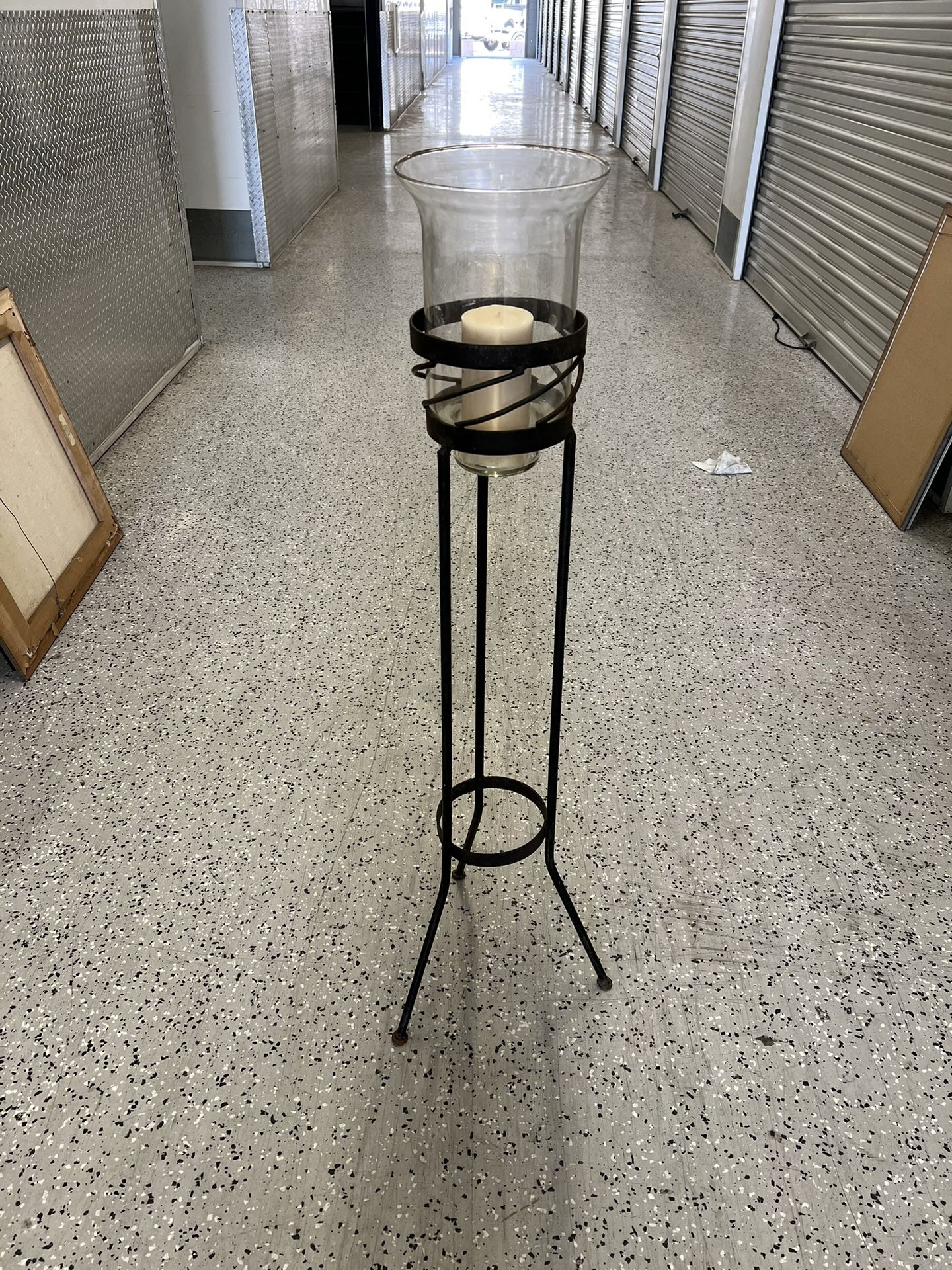 Wrought iron candle holder with hurricane glass
