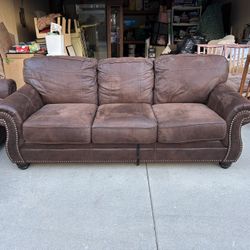 Three Seat Brown Leather Couch. 