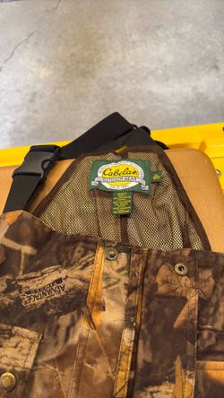 a mesh-lined Cabela's Camouflage Rain / Hunting garment