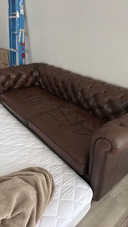 Dark coffee brown leather couch and full size mattress