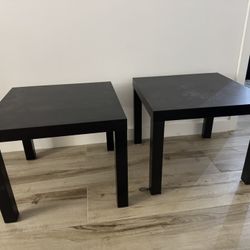 Small black wooden tables