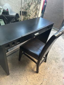 Black Sturdy desk and dark brown chair