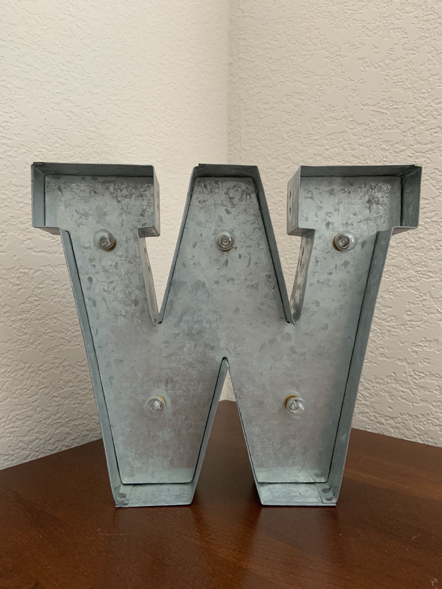 Lighted letter “W” or reverse and is a “M”