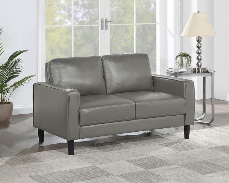 New Loveseat In Gray Faux Leather