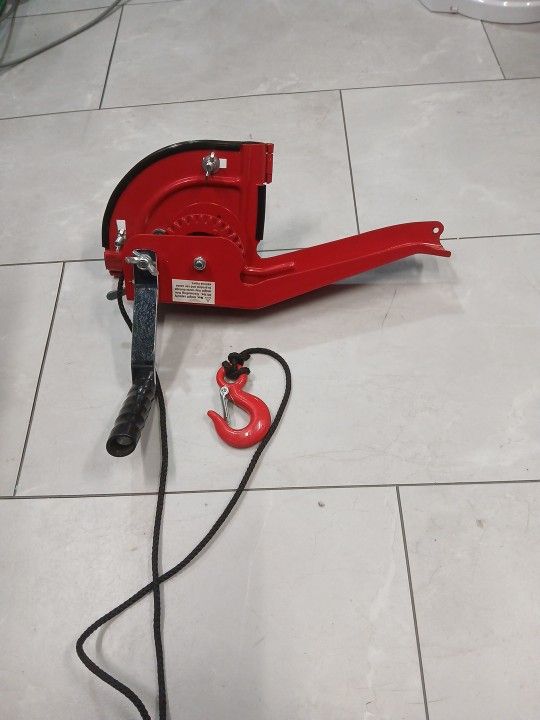 hand-cranked winch designed for use with an RV ladder.