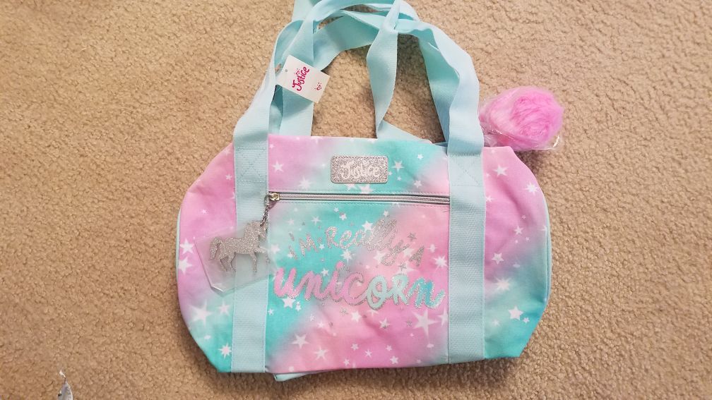 Sold Unique!! Brand new with tags justice Im really a unicorn duffle bag !!! Online only item