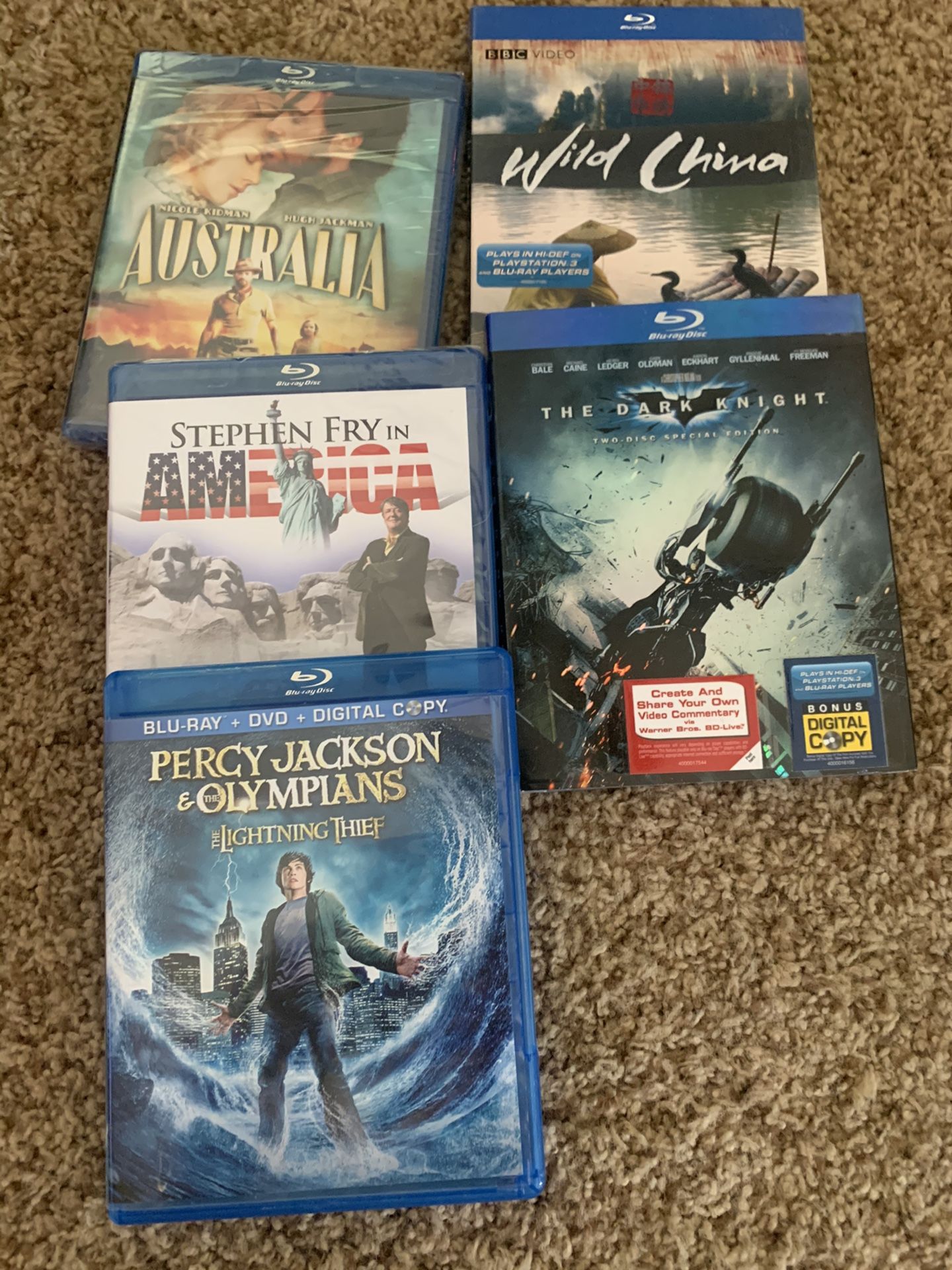 Lot of Blu-Ray Disks. All new in Plastic except Percy Jackson and the Olympians. Wild China BBC, The dark Knight. Australia. America