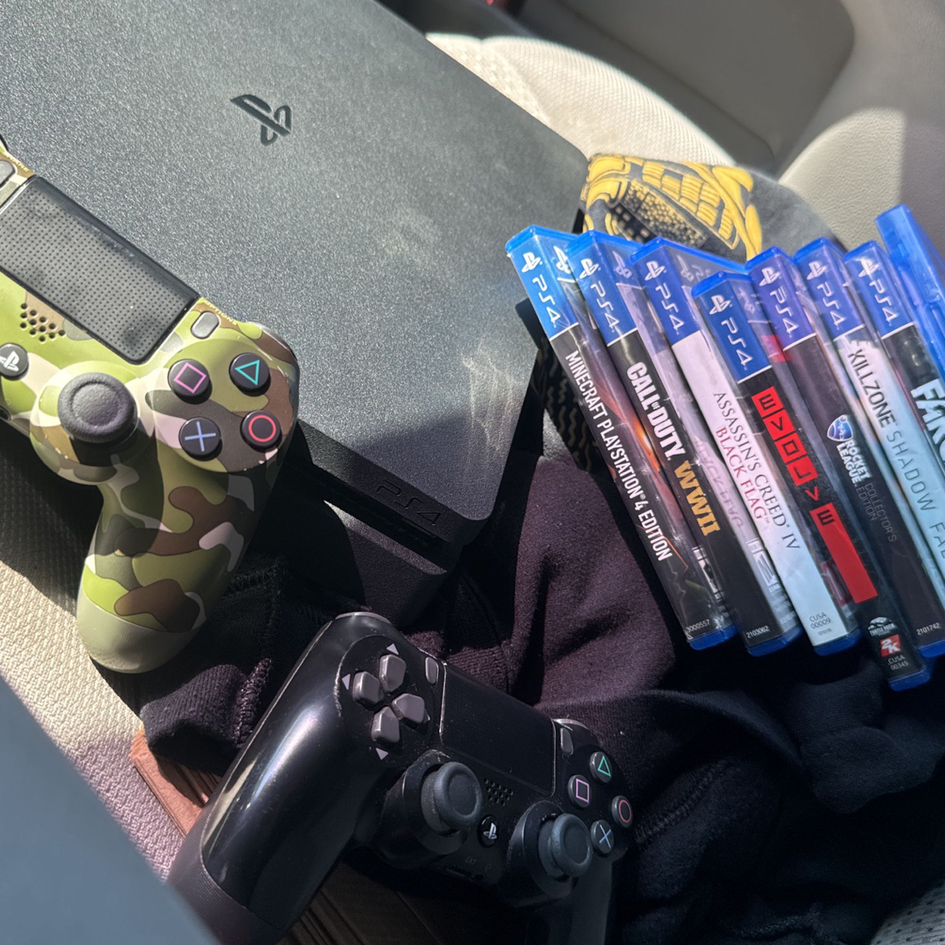 Playstation 4 One Terabyte, Two Controllers, And Eight Games