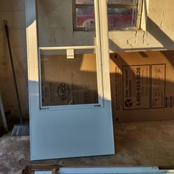 2 EMCO 100 Series Self Storing Storm Doors