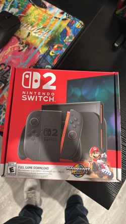 Nintendo Switch 2 with 3 games, carrying case and screen protector plus original box.