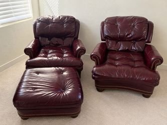2 burgundy leather chairs + ottoman