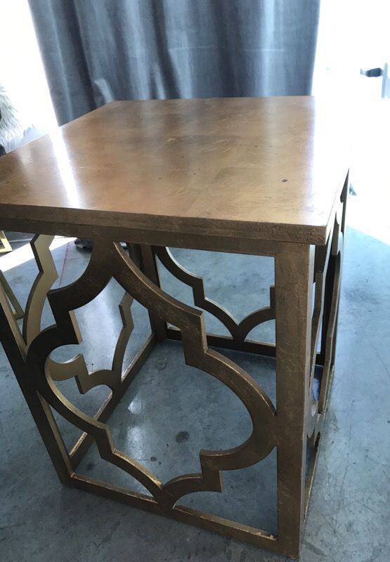2 matching gold Moroccan design end tables