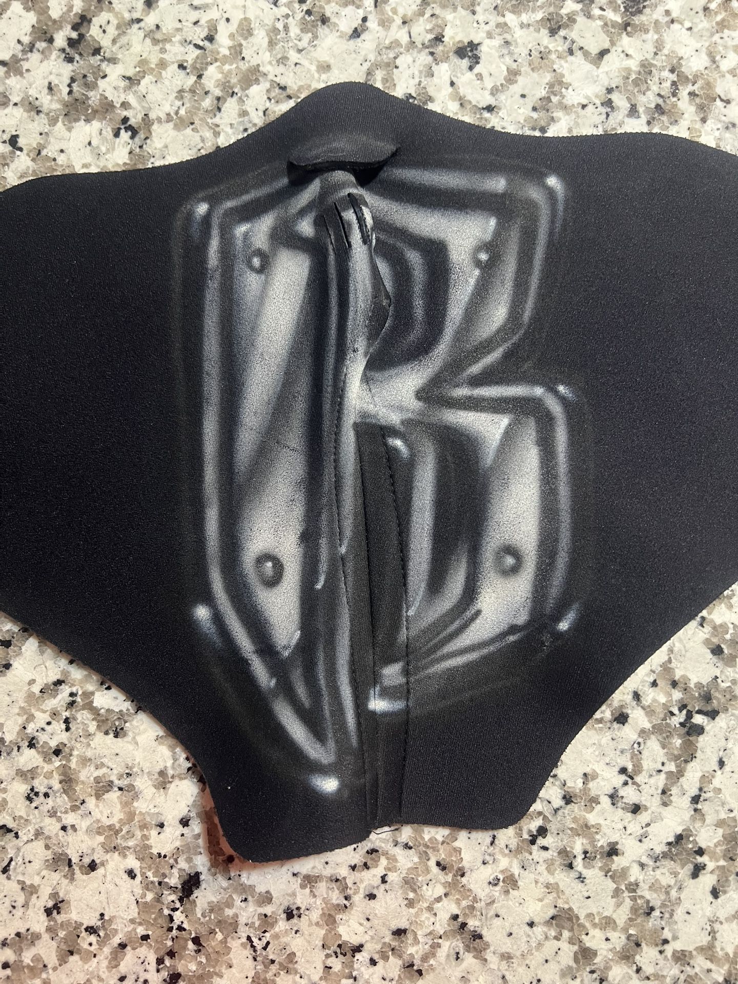 RuffRyders Black and Gray Graphic Neoprene Mask Stylish neoprene mask with bold black and gray graphic design. Perfect for adding an edgy touch to yo