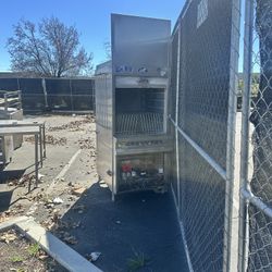 Commercial stainless steel walk-in refrigerator for sale. Includes top-mounted refrigeration unit and control panel.  • Heavy-duty stainless steel • W