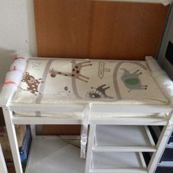 white changing table + changing pad + two pad covers