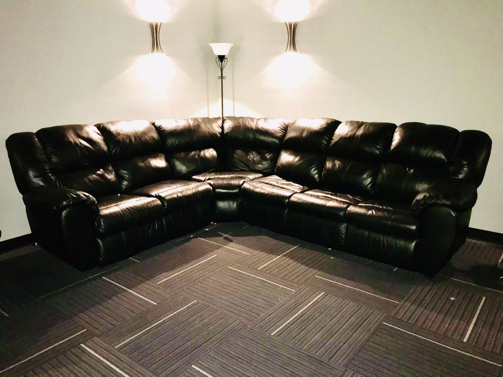 Black Leather Sectional with 2 Recliners and Sleeper