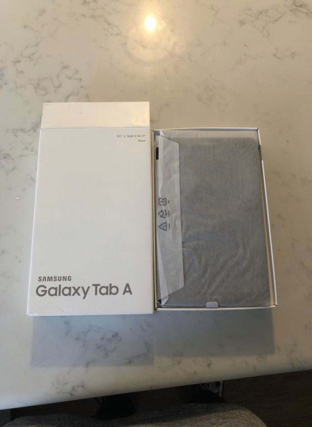 Samsung Galaxy Tablet A with case and wireless headphones