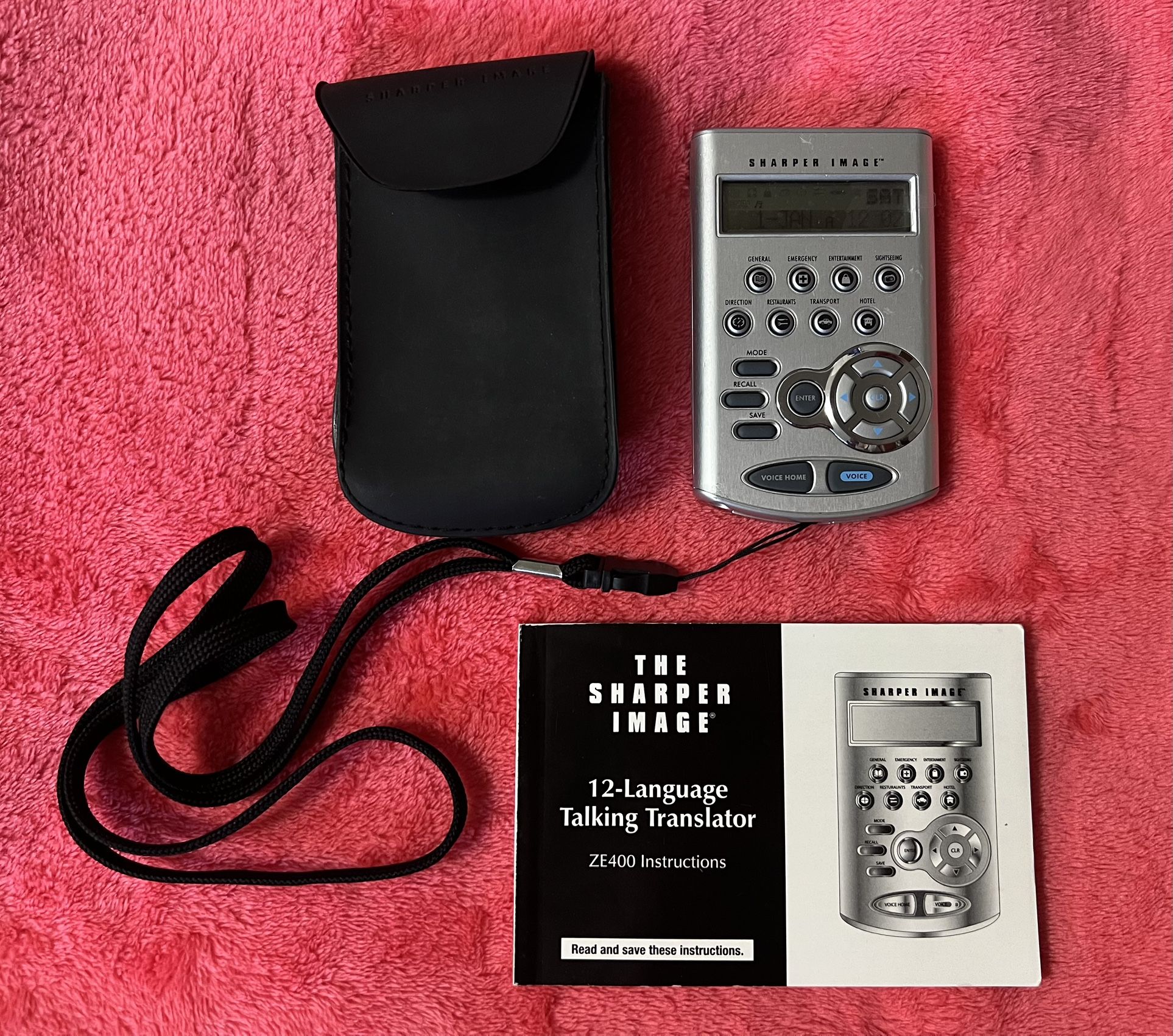 Sharper Image 12-Language Talking Translator ZE400 – Vintage Travel Companion Embark on your next adventure with the Sharper Image ZE400 Talking Tra