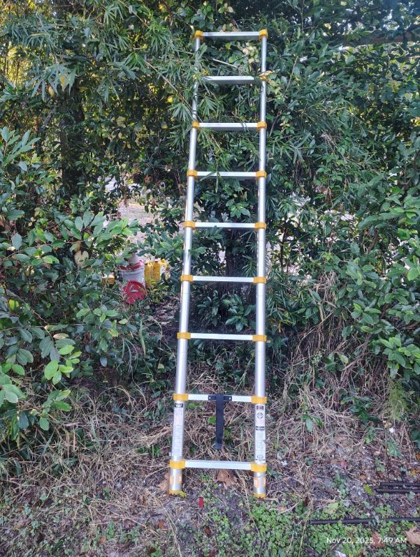 Aluminum telescopic ladder, ideal for outdoor use.$90 Located Mount Dora Fla 32757