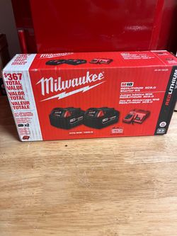 Milwaukee M18 5.0 batteries with charger