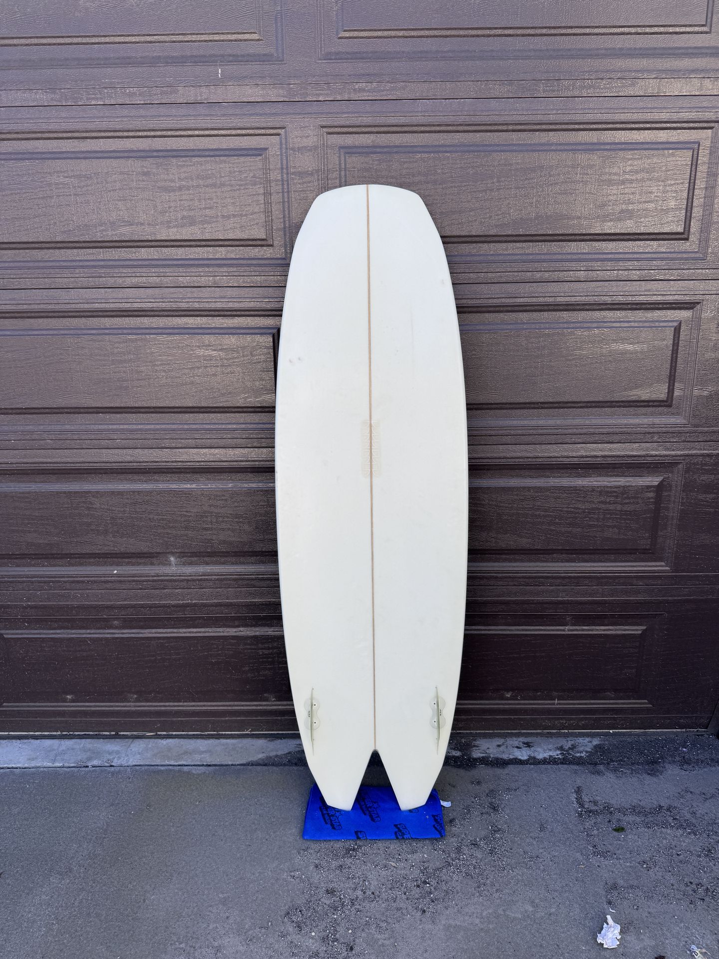 5’9” Mandala Dark Crystal surfboard with two sets of fins