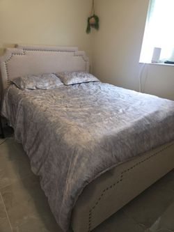 Beautiful upholstered bed frame and mattress + protector!