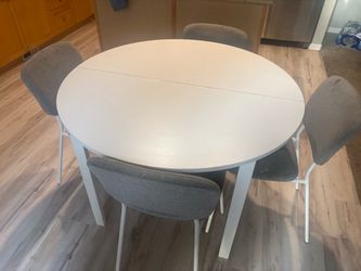 Round White Dining Table with 4 Gray Chairs