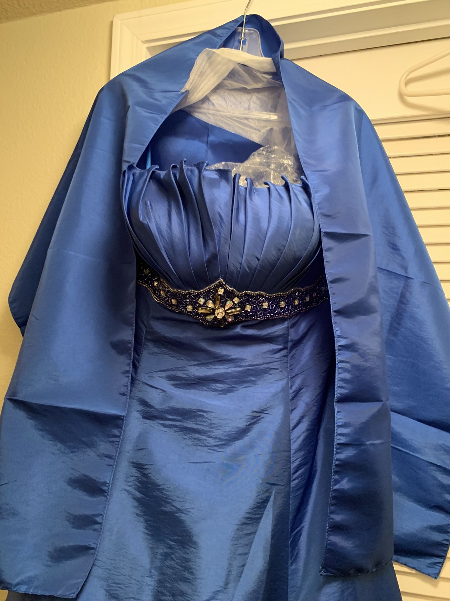 Beautiful royal blue formal hi low dress. Embellished with beads and crystals. Comes with matching shawl. Never worn. New with tags.