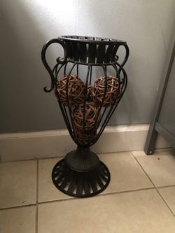 Iron vase with wooden decor inside