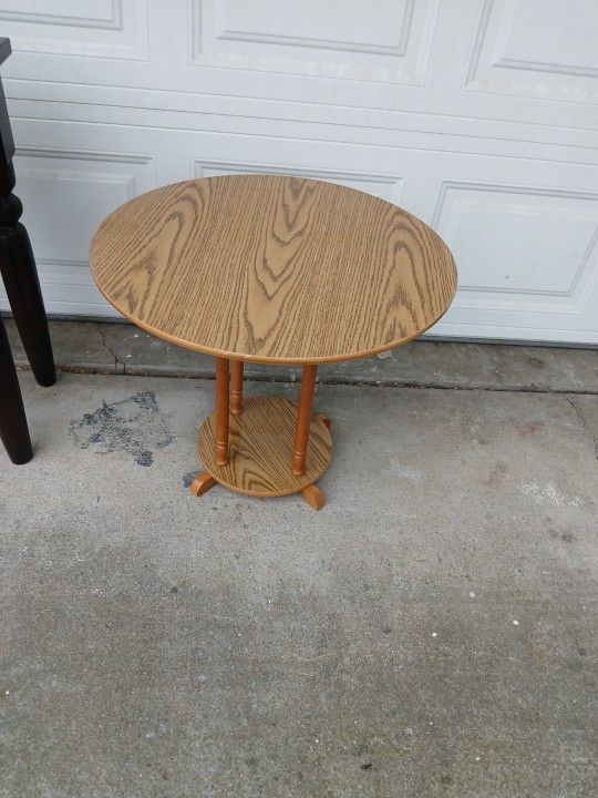 Round Two-Tier Wood Accent Table With An Oak-Look Finish