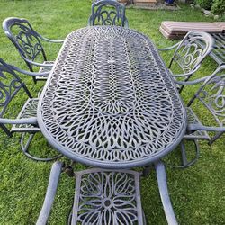 Selling our outdoor 7 Piece Cast Aluminum Patio Dining Set With Oval Table - Antique Bronze and Cast Aluminum Patio Double Chaise Lounge
