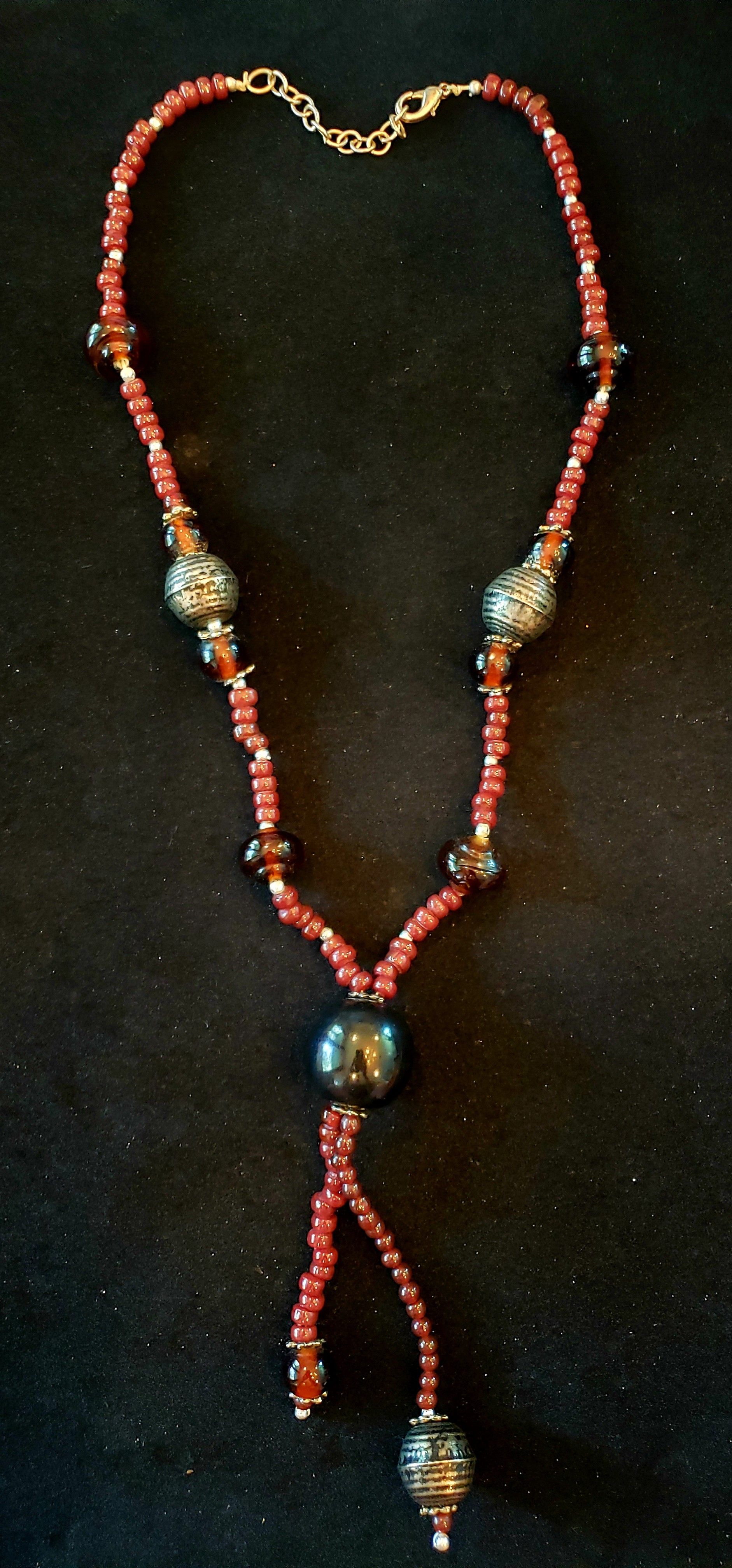 Amber colored glass bead necklace. Bohemian. Gypsy. Hippie. Necklace is 20 in.