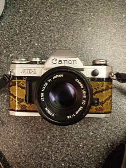 CANNON AE- 1 SNAKE SKIN COVERED CAMERA ONE OF A KIND FER SURE 150