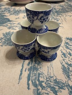 5 small blue and white egg cups