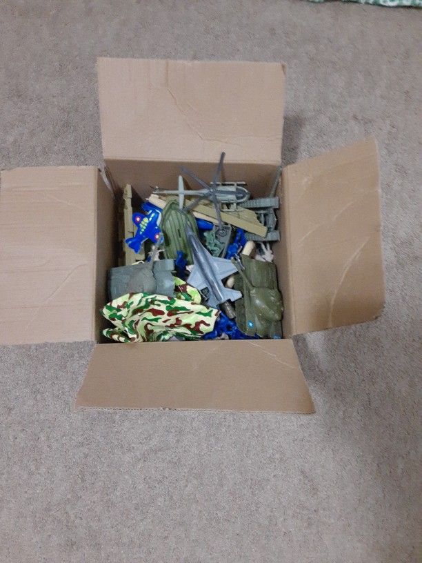 A Box Of Army Guys And Military Vehicles