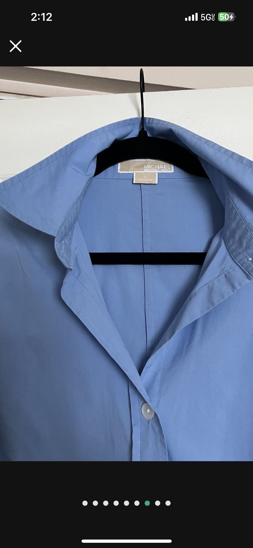 It’s A Beautiful Woman’s Shirt In Size 12 The Color Is baby blue made by Michael Kors