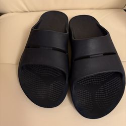 Crocs Mellow Recovery Slide. This model is characterized by its minimalist design and a deep, supportive footbed that offers superior comfort.