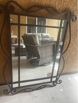 Large rod iron mirror